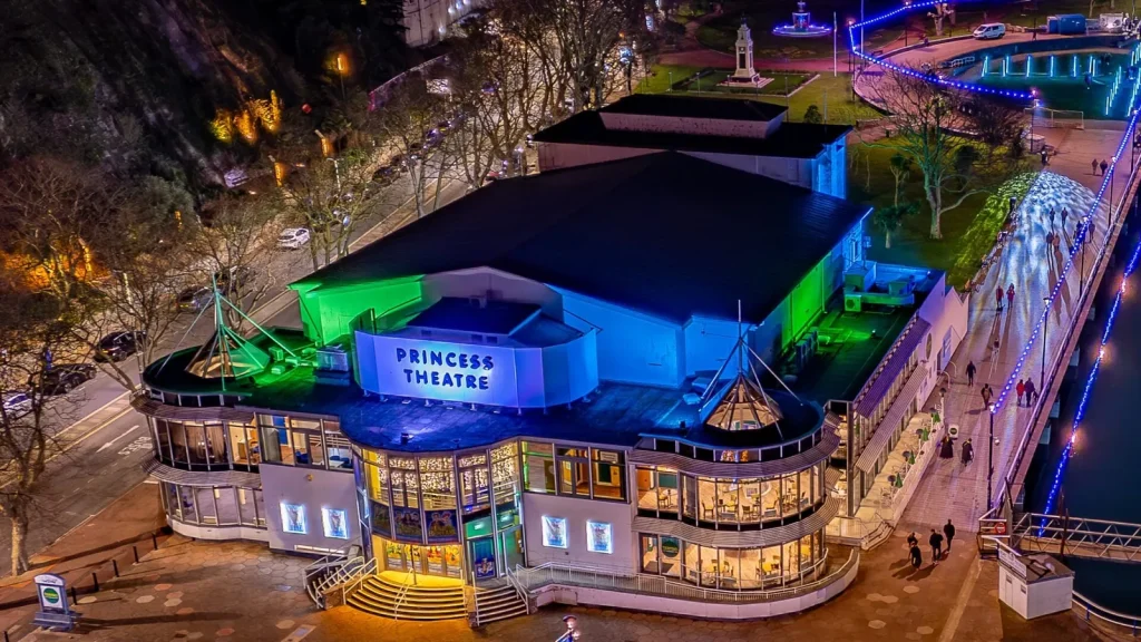 The Princess Theatre on Torquay seafront lit up at night