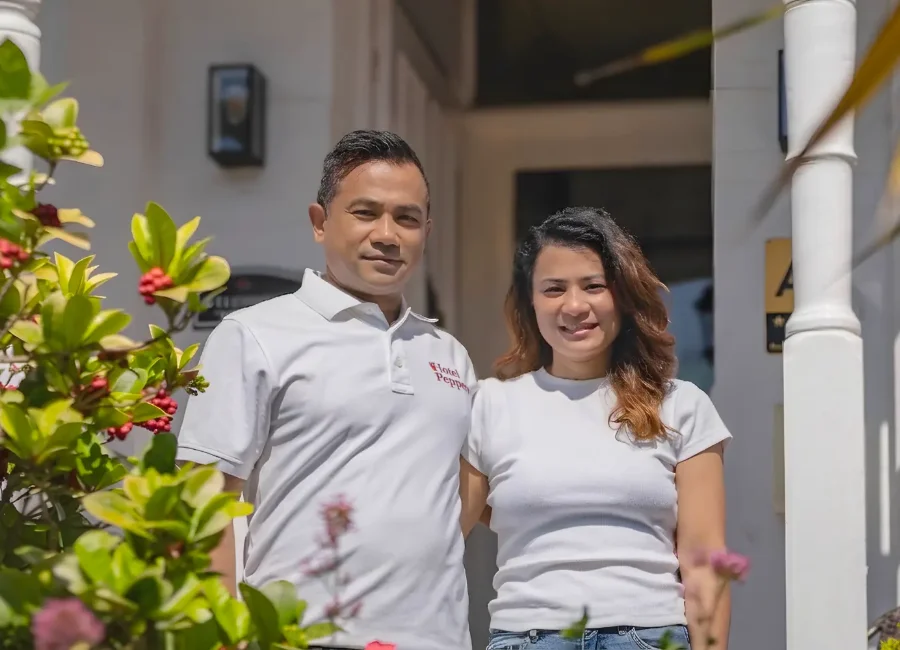 Sanjeev and Sabita at the entrance of Hotel Peppers
